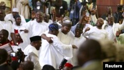 Members of the House of Representatives are seen celebrating after Rt. Hon Yakubu Dogara was sworn in as the new Speaker of the House of Representatives in Abuja, Nigeria, June 9, 2015. REUTERS/Afolabi Sotunde - RTX1FUGZ