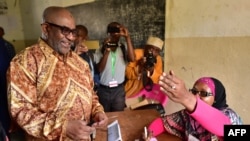 FILE - Comoros' President Azali Assoumani arrives at a polling station to cast his ballot during a constitutional referendum, July 30, 2018, outside Moroni capital of the Comoros archipelago off Africa's east coast.