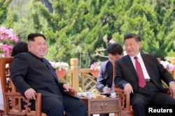 FILE - North Korean leader Kim Jong Un meets with China's President Xi Jinping, in Dalian, China in this undated photo released on May 9, 2018 by North Korea's Korean Central News Agency (KCNA).