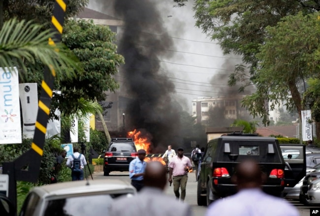Fire and smoke rises from an explosion in Nairobi, Kenya, Jan. 15, 2019. An upscale hotel complex in Kenya's capital came under attack with a blast and heavy gunfire.