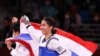 Tokyo 2020 Olympics - Taekwondo - Women's Flyweight - 49kg - Gold medal match - Makuhari Messe Hall A, Chiba, Japan - July 24, 2021. Panipak Wongphatthanakit of Thailand celebrates winning gold with the Thai national flag REUTERS/Murad Sezer