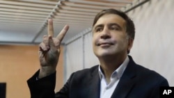 FILE - Former Georgian President Mikheil Saakashvili gestures in a court room in Kyev, Ukraine, Dec. 11, 2017. 