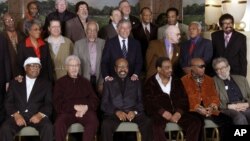 FILE - Jazz legends pose for a group portrait of National Endowment for the Arts Jazz Masters of the past and present, in New York, Jan. 13, 2006. At foreground right is writer Nat Hentoff. His son, Tom Hentoff, said his father died, Jan. 7, 2017, from natural causes at his Greenwich Village apartment. He was 91. 