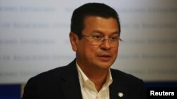 FILE - El Salvador's Foreign Minister Hugo Martinez participates in a news conference in San Salvador, El Salvador, June 13, 2017. 