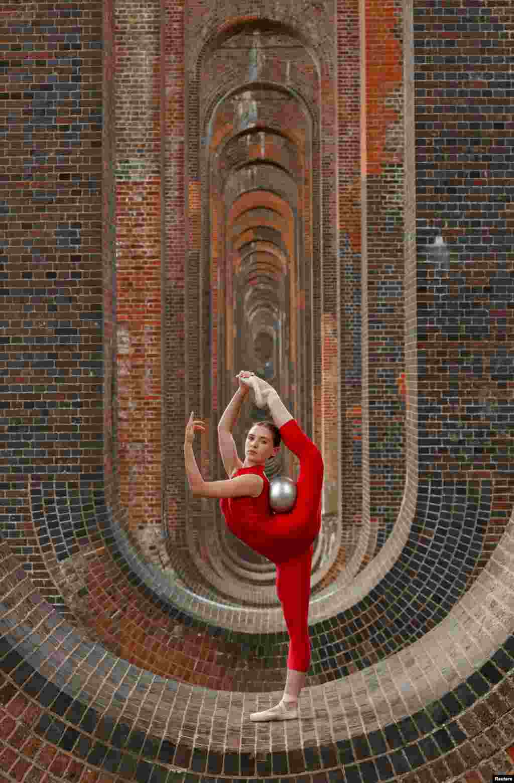 Former British Rhythmic Gymnastic star and dancer Hannah Martin is seen during a training session at Ouse Valley Viaduct in Sussex, Britain.