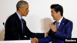 U.S. President Barack Obama shakes hands with Japan's Prime Minister Shinzo Abe after a bilateral meeting during the 2016 Ise-Shima G7 Summit in Shima, Japan, May 25, 2016.