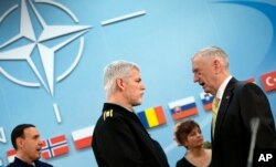 Chairman of the Military Committee, General Petr Pavel speaks with U.S. Secretary of Defense Jim Mattis, right, during a meeting of the North Atlantic Council at NATO headquarters in Brussels, Feb. 16, 2017.