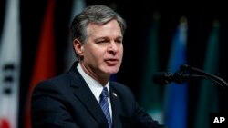 FILE - FBI Director Christopher Wray speaks during the FBI National Academy graduation ceremony, Dec. 15, 2017, in Quantico, Va.