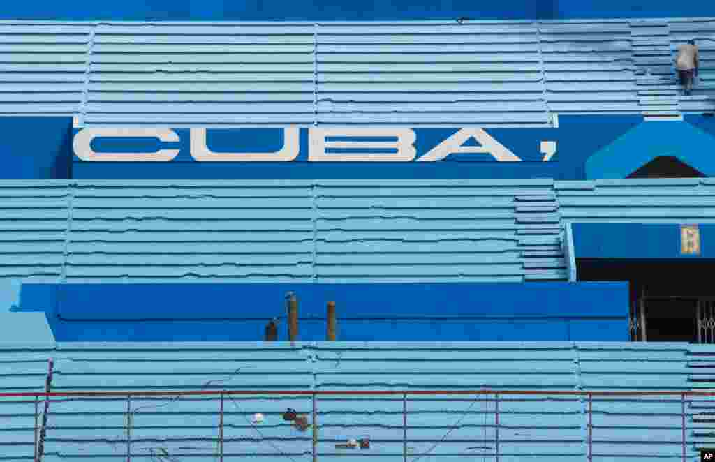 A worker paints the stands at the Latinoamericano Stadium baseball arena in Havana, Cuba. U.S. President Barack Obama plans to attend the Tampa Bay Rays&#39; exhibition game at the arena on March 22 during his visit to Cuba.