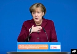 German Chancellor Angela Merkel delivers a speech at a local meeting of her Christian Democrats, CDU, in Grimmen, northern Germany, Jan. 28, 2017.