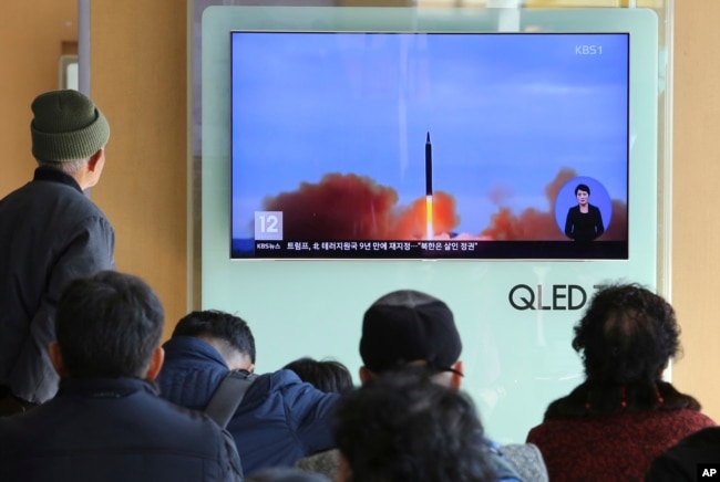 FILE - People watch a TV screen showing file footage of North Korea's missile launch at Seoul Railway Station in Seoul, South Korea, Nov. 21, 2017.