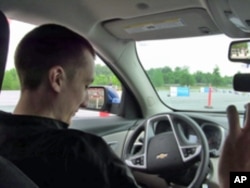 Kevin Schumann, 19, tests his driving skills - with and without distractions - on an obstacle course in Washington, DC.