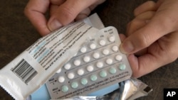 FILE - A one-month dosage of hormonal birth control pills is displayed in Sacramento, Calif., Aug. 26, 2016.