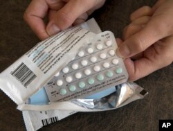 FILE - A one-month dosage of hormonal birth control pills is displayed Aug. 26, 2016, in Sacramento, Calif.