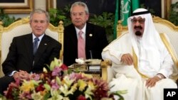 FILE - President George W. Bush sits with Saudi King Abdullah upon his arrival at Riyadh-King Kahlid International Airport in Riyadh, Saudi Arabia, May 16, 2008.