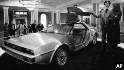 John Z. DeLorean and his wife Christina with the DeLorean model 12 prototype car as it was unveiled in New Orleans, La., Jan. 31, 1977.