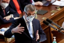 FILE - Czech Prime Minister Andrej Babis gestures as he speaks at a parliamentary session during a no-confidence vote for his government, in Prague, Czech Republic, June 3, 2021.