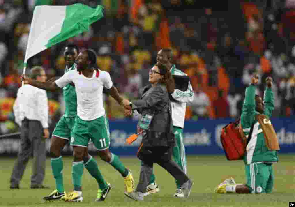 Nigeria's Victor Moses holds the flag as he celebrate after winning the African Cup of Nations final soccer match against Burkina Faso at Soccer City Stadium in Johannesburg, South Africa, Sunday Feb. 10, 2013. (AP Photo/Themba Hadebe)