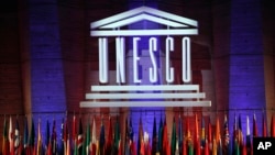 FILE - The logo of the United Nations Educational, Scientific and Cultural Organisation (UNESCO) is seen druing a conference at UNESCO headquarters in Paris, France, Nov. 4, 2017. 