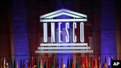 FILE - The logo of the United Nations Educational, Scientific and Cultural Organization (UNESCO) is seen during a conference at UNESCO headquarters in Paris, France, Nov. 4, 2017. 