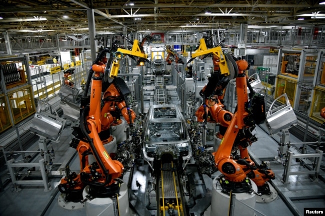 FILE - Autonomous robots assemble an X model SUV at the BMW manufacturing facility in Greer, South Carolina, U.S. November 4, 2019. (REUTERS/Charles Mostoller)