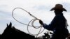 A cowboy waits to enter the arena for the calf roping competition at the International Finals Youth Rodeo, in Shawnee