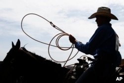 A cowboy could be considered a "meat-and-potatoes" man.