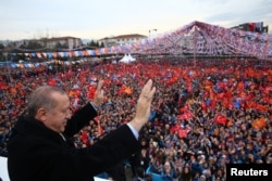 FILE - Turkish President Tayyip Erdogan greets his supporters during a rally in Bursa, Turkey, Jan. 21, 2018.