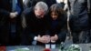 FILE - New York City Mayor Bill de Blasio and Paris Mayor Anne Hidalgo light candles in tribute to the victims of the terror attack against Charlie Hebdo at Place de la Republique in Paris, Jan. 20, 2015.