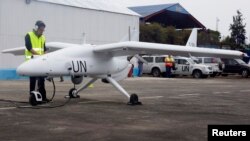 FILE - A technician checks a surveillance Unmanned Aerial Vehicles (UAV) drone operated by the United Nations in the Democratic Republic of Congo's eastern city of Goma. United Nations forces in Democratic Republic of Congo launched unmanned aircraft to monitor the volatile border with Rwanda and Uganda, the first time.