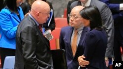 United Nations Ambassadors Vasily Nebenzya of Russia, left, Liu Jieyi of China, center, and Nikki Haley of the U.S., right, confer after the United Nations nonproliferation meeting on North Korea, Sept. 4, 2017 at U.N. headquarters.