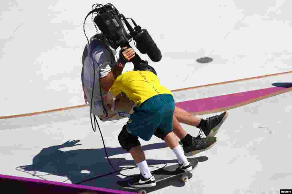 Kieran Woolley of Australia crashes into a cameraman&nbsp;in the men&#39;s park skateboarding preliminary round at the 2020 Summer Olympics in Tokyo, Japan.