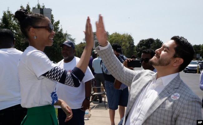 Dr. Abdul El-Sayed high-fives supporter Sonique Watson in Detroit, Aug. 8, 2017. Perhaps no state has embraced the political outsider as much as Michigan. But El-Sayed, a 32-year-old liberal doctor, is putting that affinity for newcomers to the test by mounting a surprisingly strong bid to become the nation’s first Muslim governor.