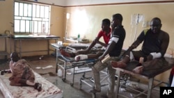 FILE- Victims of an explosion receive treatment at a ill-staffed health facility in Maiduguri, Nigeria, Sept. 21, 2015.