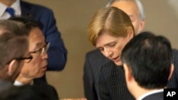 Motohide Yoshikawa, left, Japan's ambassador to the United Nations, talks with Samantha Power, the U.S. ambassador, following a Security Council meeting at U.N. headquarters, Sunday, Feb. 7, 2016.