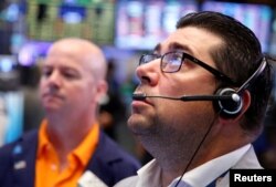 Traders nervously work on the floor of the New York Stock Exchange before the opening bell and a day after Britain's vote to leave the EU on June 24, 2016. (Reuters)