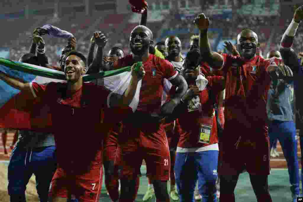 Equatorial Guinea&#39;s soccer players celebrate their 1-0 win at the end of the soccer match against Sierra Leone in Cameroon on Jan. 20, 2022.