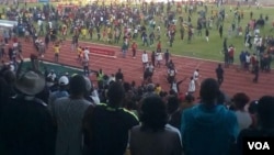 Zimbabwe Warriors fans celebrate after the final whistle at Royal Bafokeng Sports Palace in Phokeng, Rustenburg, South Africa.