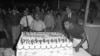 Muhammad Ali meniup lilin di atas kue ulang tahunnya yang ke-25, di Houston. (AP/Ed Kolenovsky).