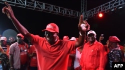 FILE - Sierra Leone's All People's Congress presidential candidate Samura Kamara waves to supporters during a campaign rally in Mekeni, northen Sierra Leone, March 5, 2018. 