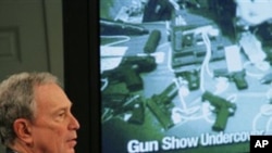 New York City Mayor Michael Bloomberg shows an undercover video that he says shows undercover investigators working for New York City were not required to pass a background check at a Phoenix, Arizona, gun show, January 31, 2011