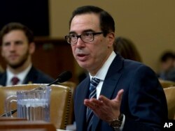 FILE - Treasury Secretary Steven Mnuchin testifies before the House Ways and Means Committee on Capitol Hill in Washington, March 14, 2019.