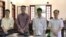 Bốn bị cáo tại phiên tòa ở Đồng Nai. (Ảnh chụp màn hình TTXVN)
