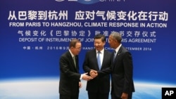 Chinese President Xi Jinping, center, U.S. President Barack Obama, right, and U.N. Secretary-General Ban Ki-moon shake hands during a joint ratification of the Paris climate change agreement at the West Lake State Guest House in Hangzhou in eastern China's Zhejiang province, Saturday, Sept. 3, 2016. (How Hwee Young/Pool Photo via AP)