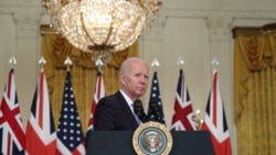 FILE - U.S. President Joe Biden delivers remarks on a National Security Initiative virtually with Australian Prime Minister Scott Morrison and British Prime Minister Boris Johnson, both not pictured, at the White House in Washington, Sept. 15, 2021.