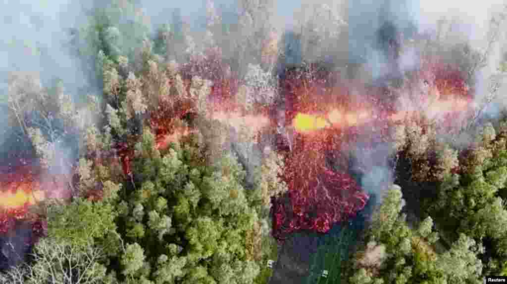 Lava emerges from the ground after Kilauea Volcano erupted, on Hawaii&#39;s Big Island, in this still image taken from video obtained from social media.