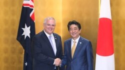 Scott Morrison shakes hands with Shinzo Abe