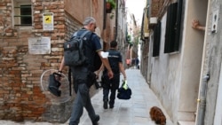 Italian Italian Guardia di Finanza police officers patrol in an alley of the red zone, in the Arsenal district, a day before G20 finance ministers and central bankers meet, in Venice on July 8, 2021.