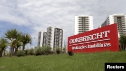 FILE - A sign of the Odebrecht SA construction conglomerate is pictured in Rio de Janeiro, Brazil, Feb. 26, 2016.