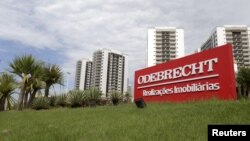 FILE - A sign of the Odebrecht SA construction conglomerate is pictured in Rio de Janeiro, Brazil, Feb. 26, 2016.